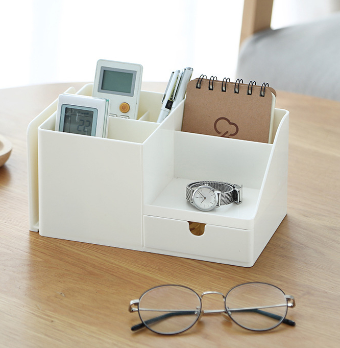 White desk organizer with compartments and a drawer
