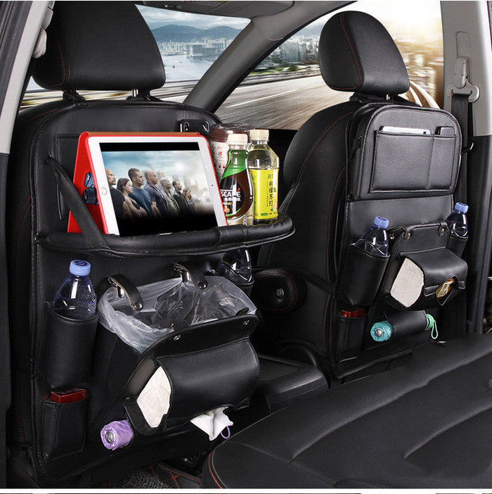 PU leather seat back organizer with tray hanging on the back of a car seat