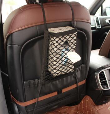 Black elastic mesh storage net hooked between car front seats - view 2