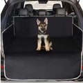 Dog sitting on a black cargo liner in an SUV trunk - view 5