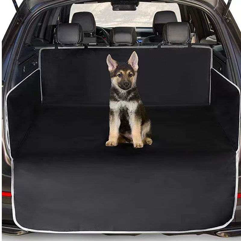 Dog sitting on a black cargo liner in an SUV trunk - view 5