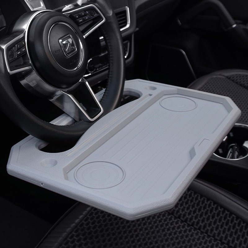 Steering wheel tray used as a laptop desk in a parked car - view 5