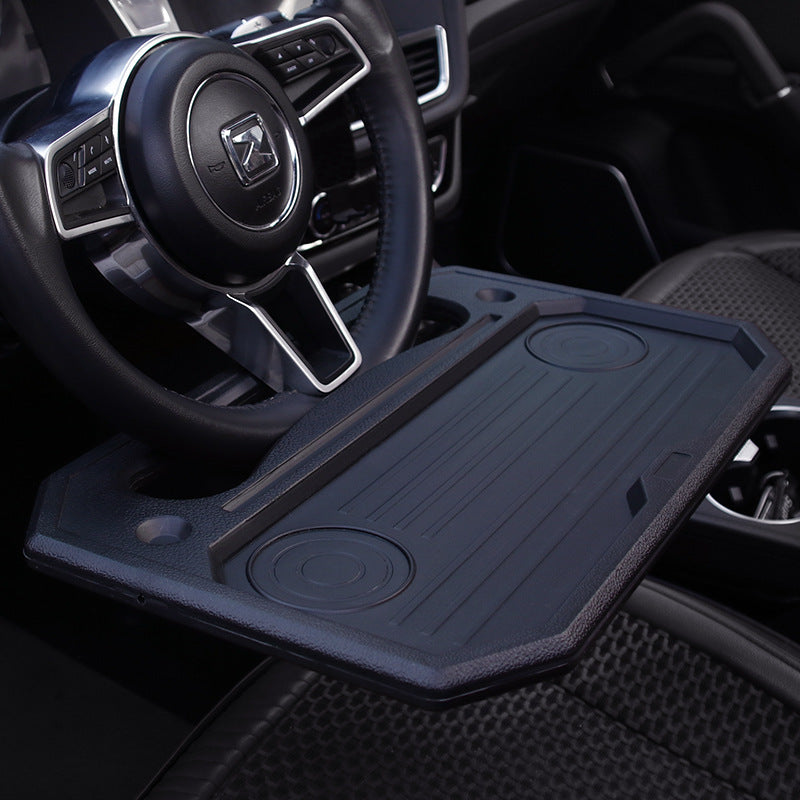 Steering wheel tray used as a laptop desk in a parked car - view 2