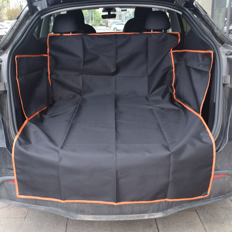 Dog sitting on a black cargo liner in an SUV trunk - view 10